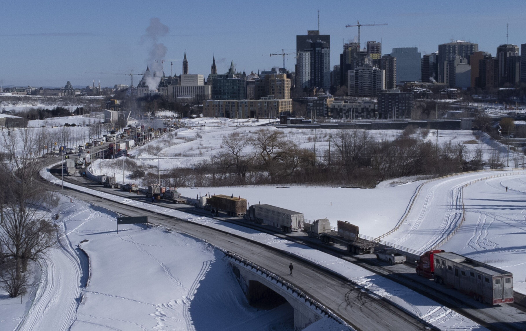 Truckers and protesters against Covid-19 mandates block a border crossing and flood Canada's capital. Trudeau responds with sharp words